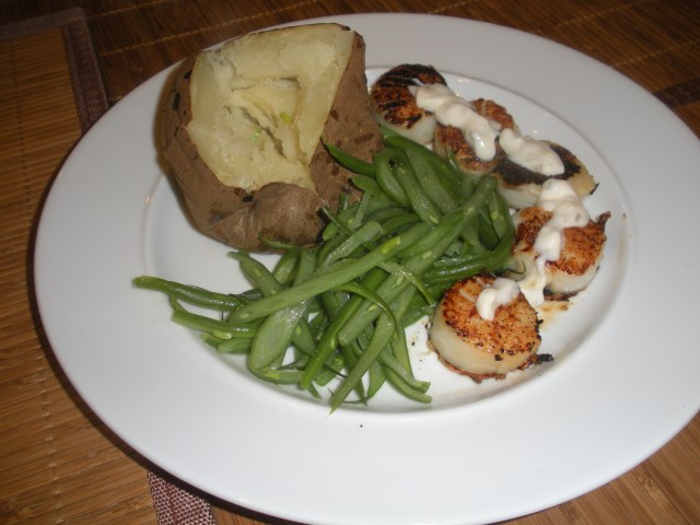 Scallops with baked potato and green beans