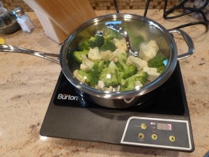 Broccoli and cauliflower cooking away on the induction burner