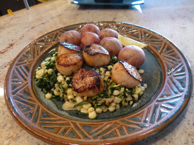 Seared! scallops on collards and corn with steamed new potatoes