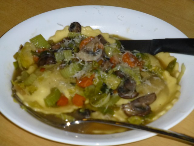 Mushroom ravioli in broth with vegetables