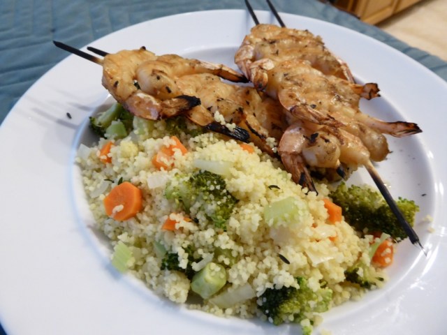 Grilled skewered shrimp with couscous and vegetables