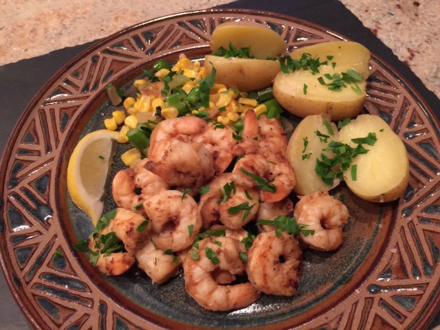 Shrimp on succotash with new potatoes