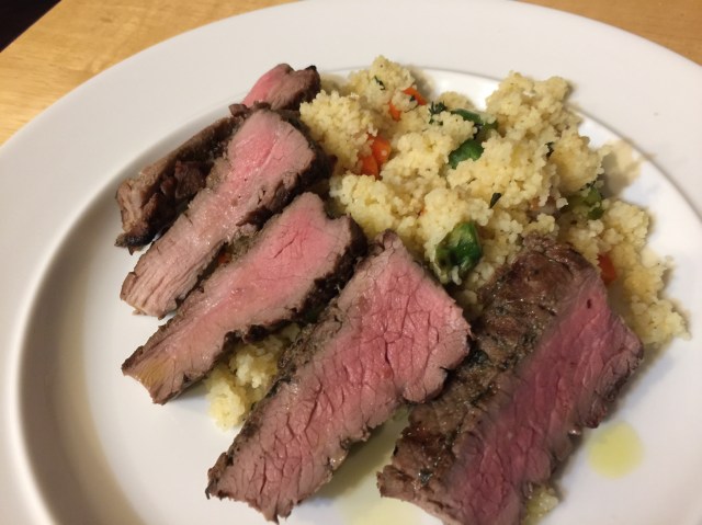 Sliced grilled lamb with couscous and vegetables
