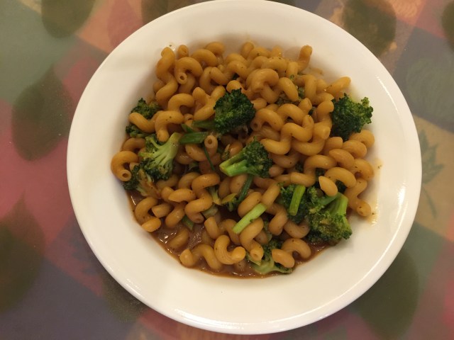Cellentani with broccoli and green onions in peanut sauce