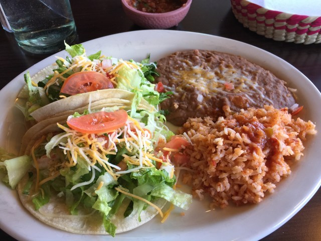 Shrimp tacos with refried beans and rice