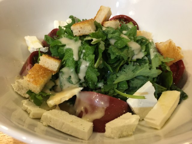 Kale salad with croutons and ricotta salata