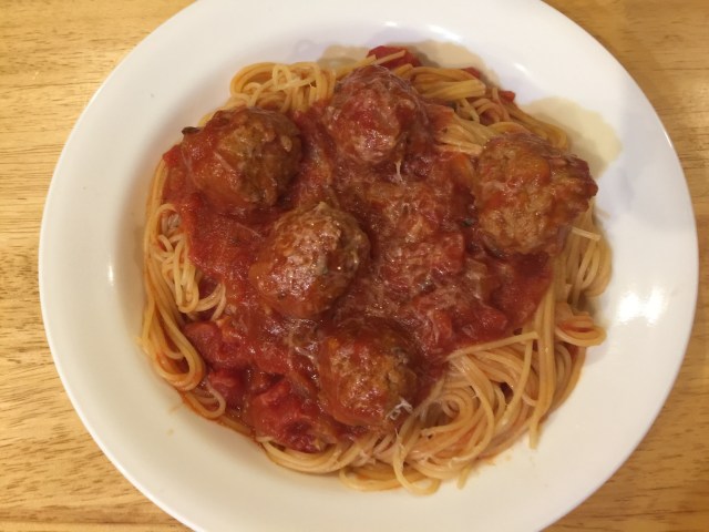 Angel hair pasta with tomato sauce and meatballs